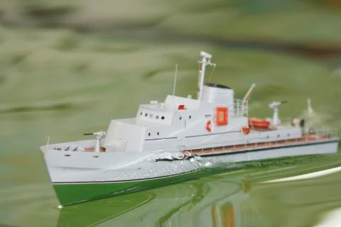 Scale ship model floating in the pool Stock Photos