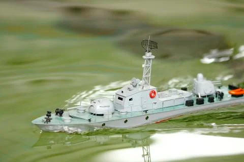 Scale ship model floating in the pool Stock Photos