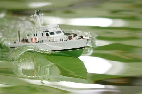 Scale ship model floating in the pool 写真素材