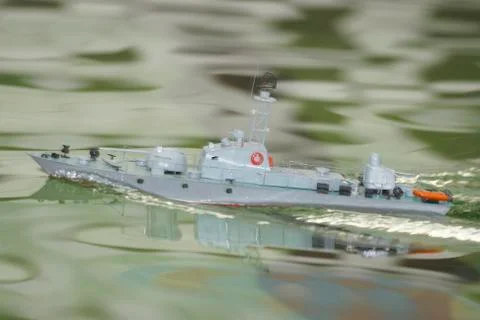 Scale ship model floating in the pool 写真素材