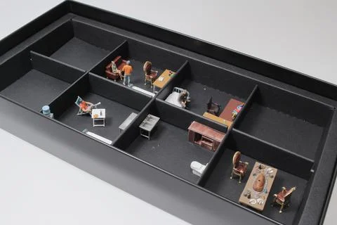 A scale of the subdivided Unit with mini figure Stock Photos