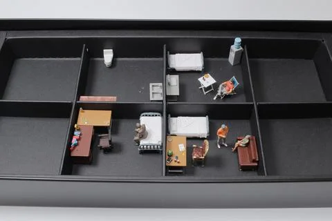 A scale of the subdivided Unit with mini figure Stock Photos