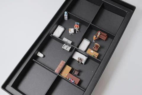 A scale of the subdivided Unit with mini figure Stock Photos