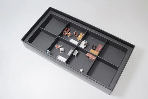 A scale of the subdivided Unit with mini figure Stock Photos