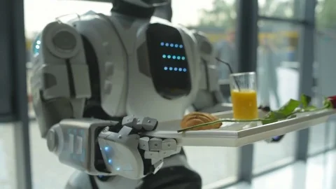 Scaled up look on robot holding trey with breakfast Stock Footage 81033931