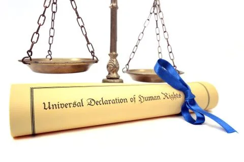 Scales of justice and The Universal Declaration of Human Rights. Stock Photos