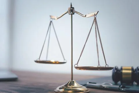Scales of justice on table.evidence-based cases and documents taken into acco Stock Photos