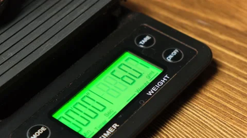 Scales show how much ground coffee weighs Stock Footage 158178232