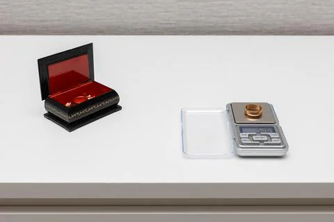 Scales for small items are on the table. jewelry scale. Stock Photos