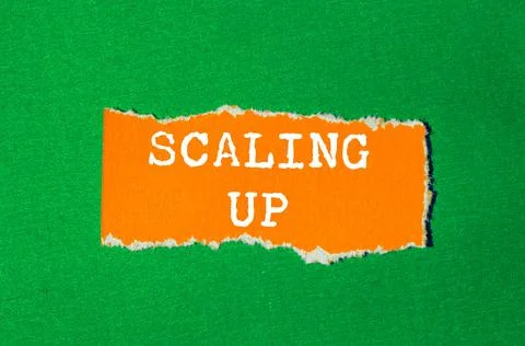 Scaling Up message written on ripped torn paper background. Conceptual Scal.. Stock Photos