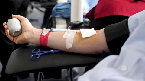 Scalise Red Cross Blood Drive Closeup on Tag and Hand Stock Footage