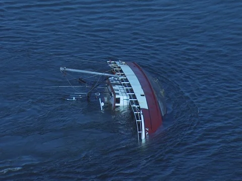 SCALLOPER SHIP OVERTURNS IN THE INLET Stock Footage 76584010