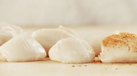 Scallops being seasoned Stock Footage 24649294