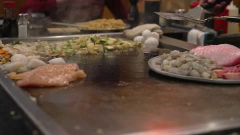 Scallops placed on hibachi by chef Stock Footage 162072887