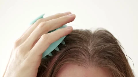 Scalp massaging brush Stock Footage 222794755