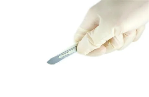 Scalpel in the hands of doctors Stock Photos
