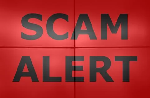 Scam alert text on red background. Stock Photos