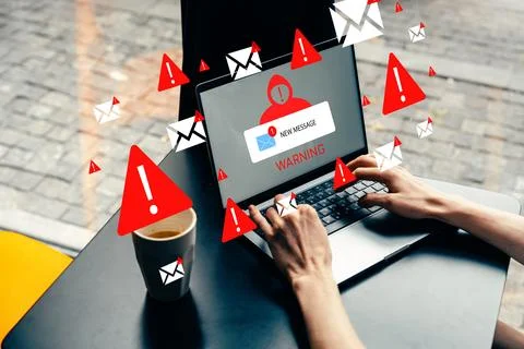 Scam call sms warning and alert on laptop screen at coffee shop in the afternoon Stock Photos