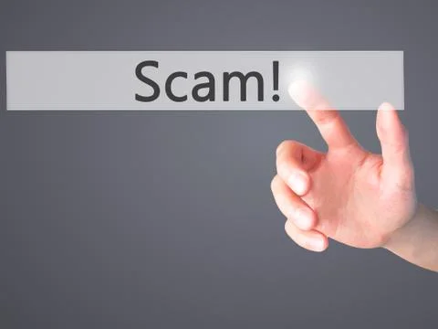 Scam! - Hand pressing a button on blurred background concept on visual screen Foto stock