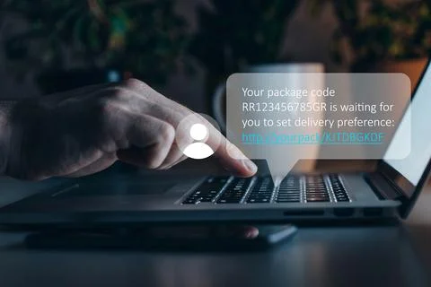 Scam message about package delivery arrives on computer screen at late night Stock Photos