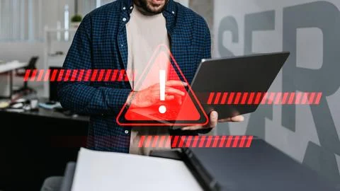 Scam message received while checking emails in an office setting Stock Photos