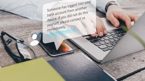 Scam message warns of unauthorized bank account access on a phone screen Stock Photos