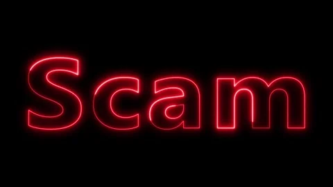 Scam text warning glowing in red neon. Stockbeeldmateriaal 332089736