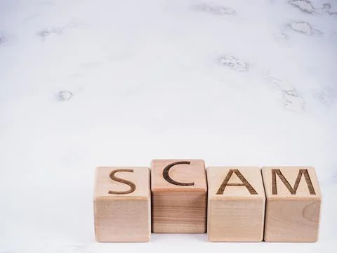 SCAM text on wooden cubes as a data phishing concept Stock Photos