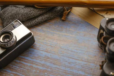 Scan background. Wooden background with camera, binoculars, cane... Stock Photos