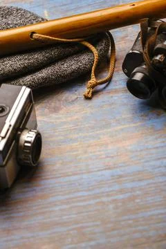 Scan background. Wooden background with camera, binoculars, cane... Stock Photos
