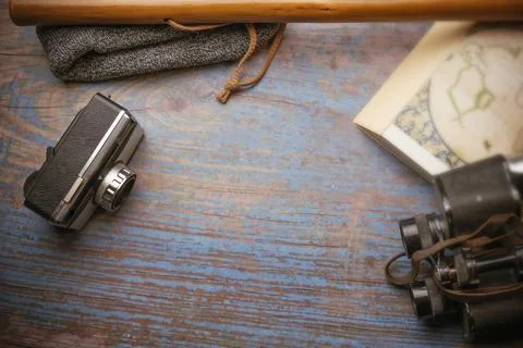 Scan background. Wooden background with camera, binoculars, cane... Stock Photos