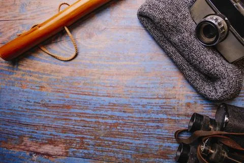 Scan background. Wooden background with camera, binoculars, cane... Stock Photos