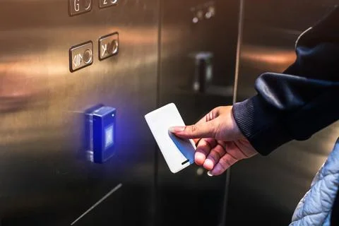 Scan the Smart Card at the elevator to specify your destination floor. Secu.. Stock Photos