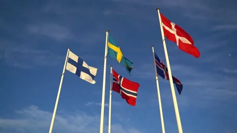 Scandinavian union flags on clear sky background Stock Footage 132100072