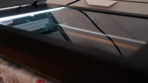 Scanner bed with glass surface and internal light bar during a document Stock Footage 292590352