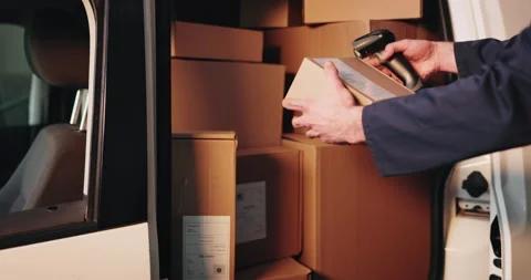 Scanner, boxes and hands of deliveryman by van for pricing, barcode or logistics 動画素材 341577070