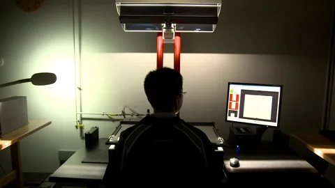 Scanner movement with male operator backlit Stock Footage 77381589