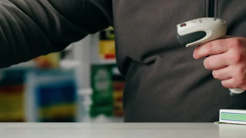 Scanner scan delivery box in pharmacy drug store storage, E-commerce shop, man Stock Footage 309642430