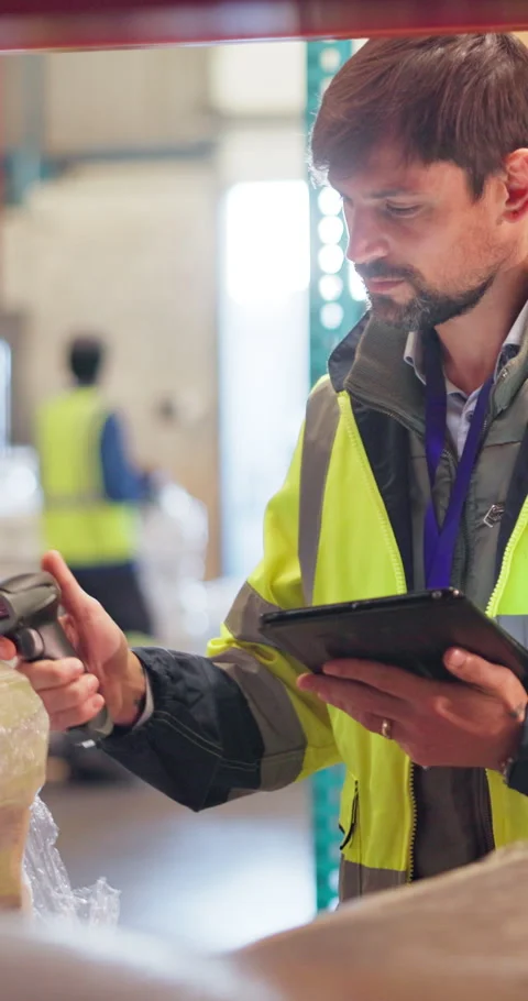 Scanner, tablet and man in warehouse, supply chain and pricing parcel with Stock Footage 315265596