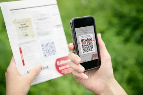 Scanning advertising with qr code on mobile phone Stock Photos