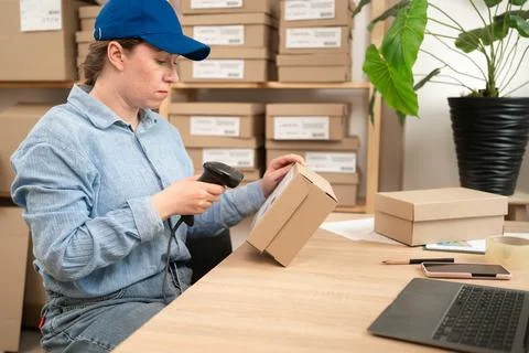 Scanning Barcode On Parcel In Ecommerce Warehouse Stock Photos