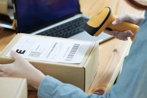 Scanning Barcode on Shipping Box with Scanner Scanning barcode on shipping... Stock Photos