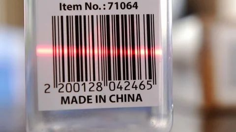 Scanning Barcodes of Multiple Products with Red Laser Barcode Scanner Rack Focus Stock Footage 104618850