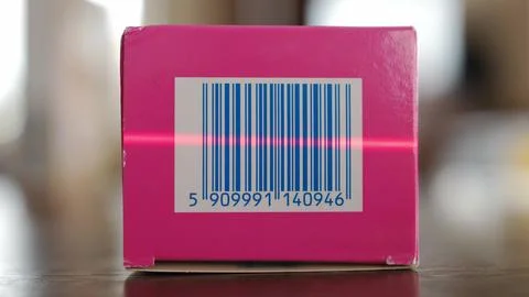 Scanning Barcodes of Multiple Products with Red Laser Barcode Scanner Stock-Fotos