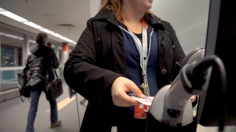 Scanning boarding pass at airport Stock Footage 120108112