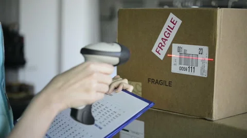 Scanning boxes with barcode scanner Stock Footage
