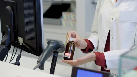 Scanning cough syrup in pharmacy Stock-Footage 88989960