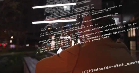 Scanning developer wearing jacket, eyeglasses, using smartphone code overlay on 스톡 사진