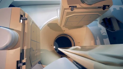 Scanning elements of tomograph are moving apart and the transporter is pulling Stock Footage 90704364