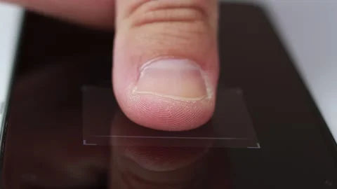 Scanning a fingerprint on an electronic device. Stock Footage 164179611